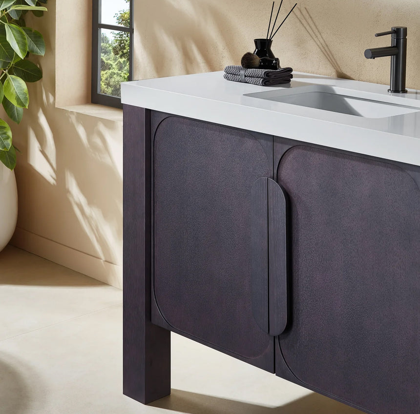 Bathroom with wooden vanity, white countertop, and decorative elements.