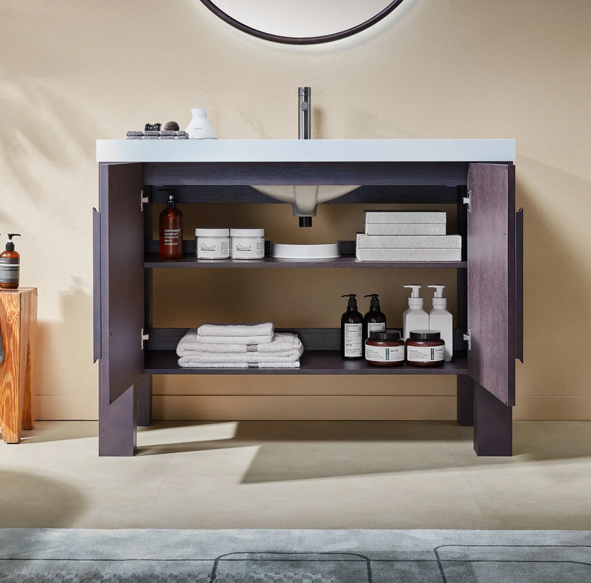 Bathroom with wooden vanity, white countertop, and decorative elements.