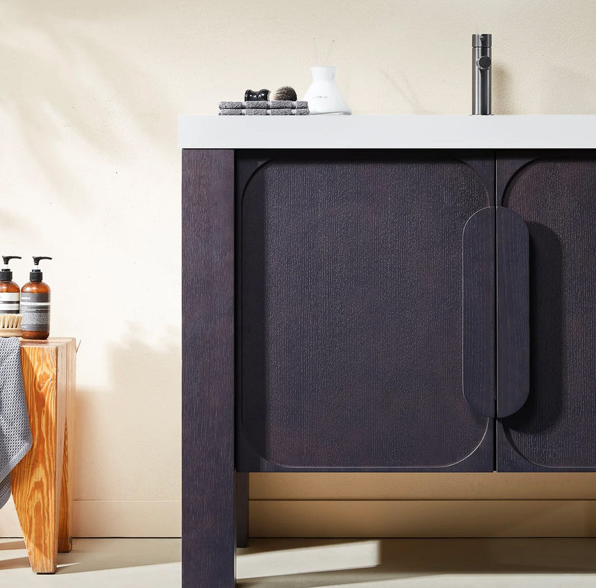 Bathroom with wooden vanity, white countertop, and decorative elements.