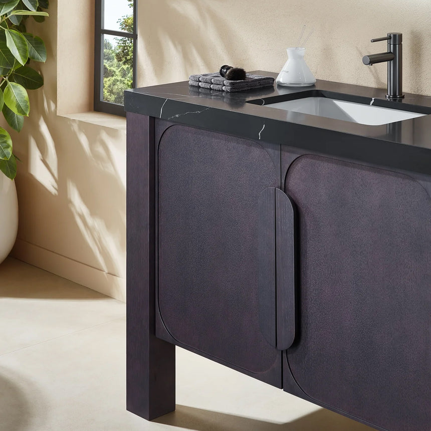 Bathroom with wooden vanity, white countertop, and decorative elements.