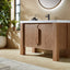 Wooden bathroom vanity with white countertop in a bright room