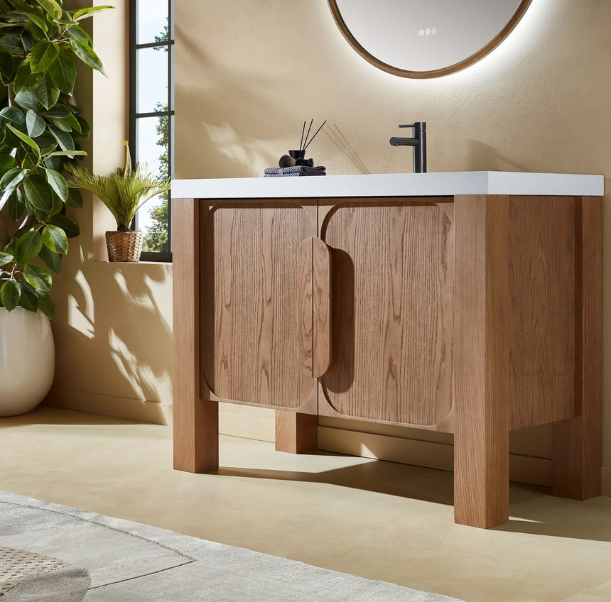 Bathroom with wooden vanity, white countertop, and decorative elements.