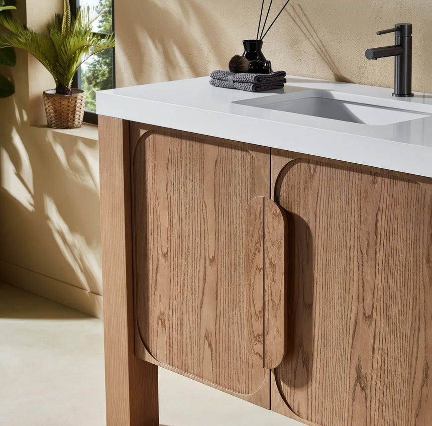 Bathroom with wooden vanity, white countertop, and decorative elements.