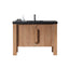 Wooden bathroom vanity with black countertop on a white background