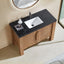 Bathroom vanity with black marble countertop and white sink, featuring a round mirror.