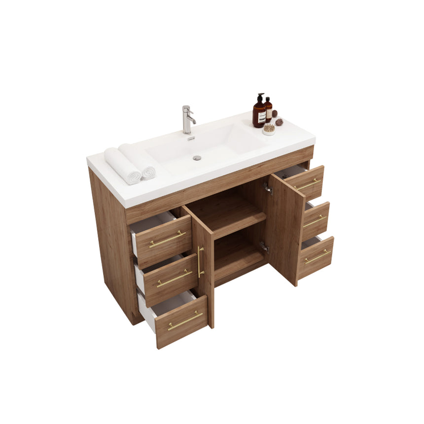 Bathroom with wooden vanity, sink, and decorative elements.