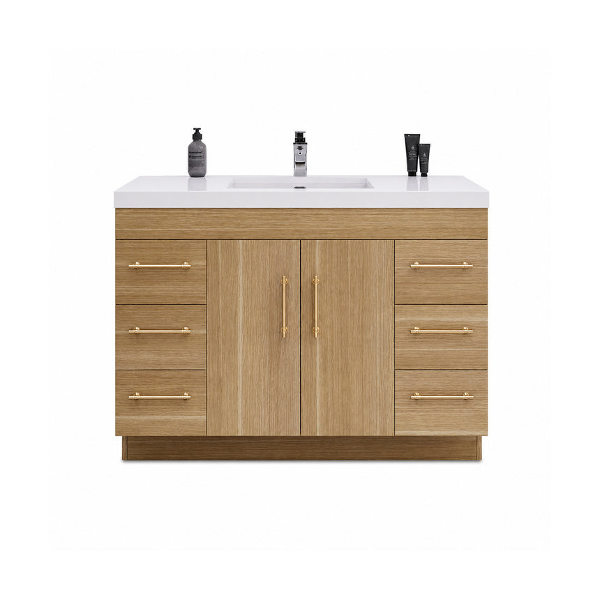 Bathroom with wooden vanity, sink, and decorative elements.