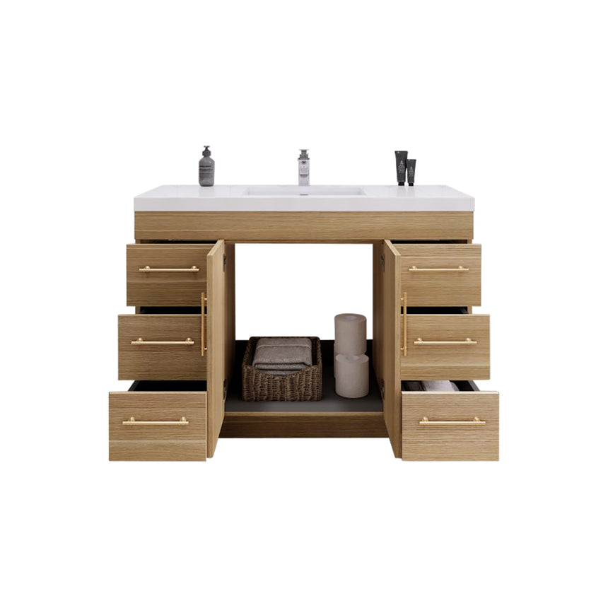 Bathroom with wooden vanity, sink, and decorative elements.