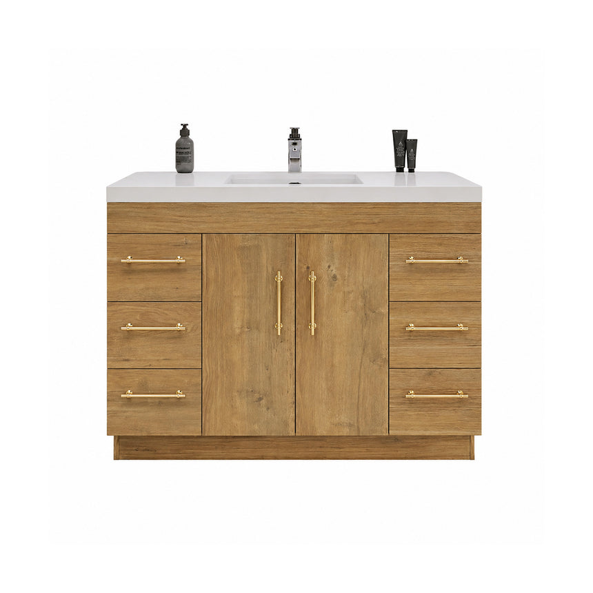 Bathroom with wooden vanity, sink, and decorative elements.