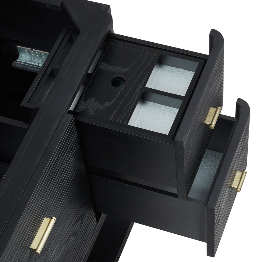 A modern bathroom vanity with a light oak wood frame, six drawers, an open lower shelf, and a white marble top with an integrated sink. The vanity is styled in a bright bathroom with a white freestanding tub, a gold faucet, and a glass shower stall in the background.