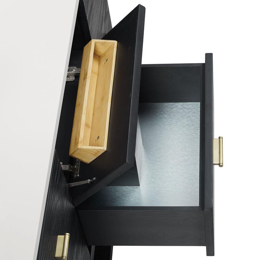 A modern bathroom vanity with a light oak wood frame, six drawers, an open lower shelf, and a white marble top with an integrated sink. The vanity is styled in a bright bathroom with a white freestanding tub, a gold faucet, and a glass shower stall in the background.
