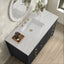Bathroom vanity with marble countertop, sink, and decorative elements.