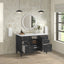 Bathroom vanity with open cabinet doors, round mirror, and decorative items.