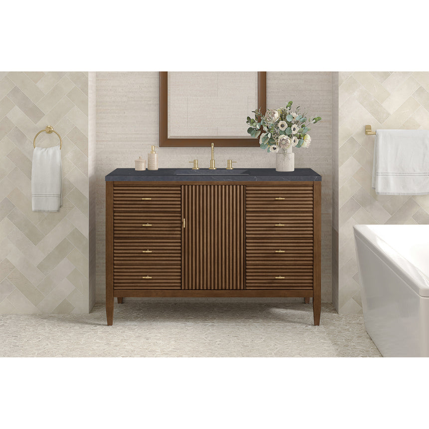 Brickendon Modern Vanity with mirror, sink, and decorative elements in a tiled bathroom.