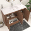 Bathroom vanity with open cabinet doors displaying toiletries, on a light-colored floor.