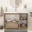 Bathroom vanity with mirror, sink, and various items on a light background