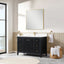 Bathroom with black vanity, white countertop, and large mirror.