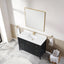 Bathroom vanity with white countertop, black cabinet, and gold fixtures.