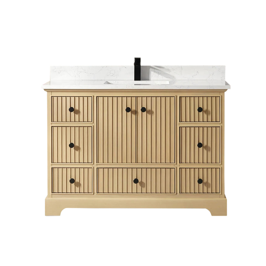 Bathroom vanity with wooden cabinet and white countertop in a bathroom setting.