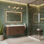 Modern bathroom with green tiles, wooden vanity, and glass shower enclosure.