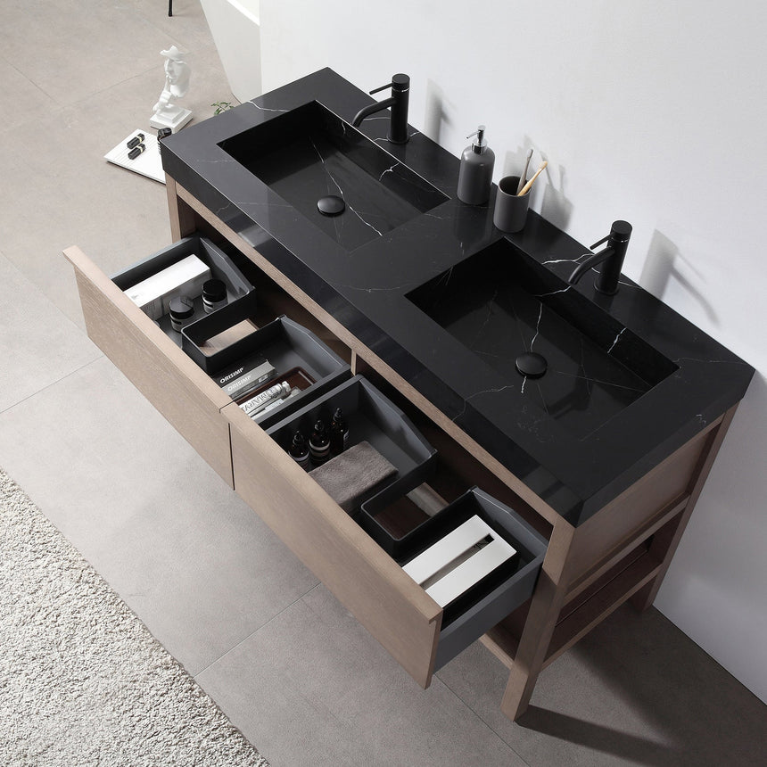 Bathroom vanity with black countertop and wooden cabinet in a bright room.