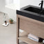 Bathroom vanity with black countertop and wooden cabinet