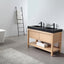 Bathroom with wooden vanity, black sinks, and a white bathtub.