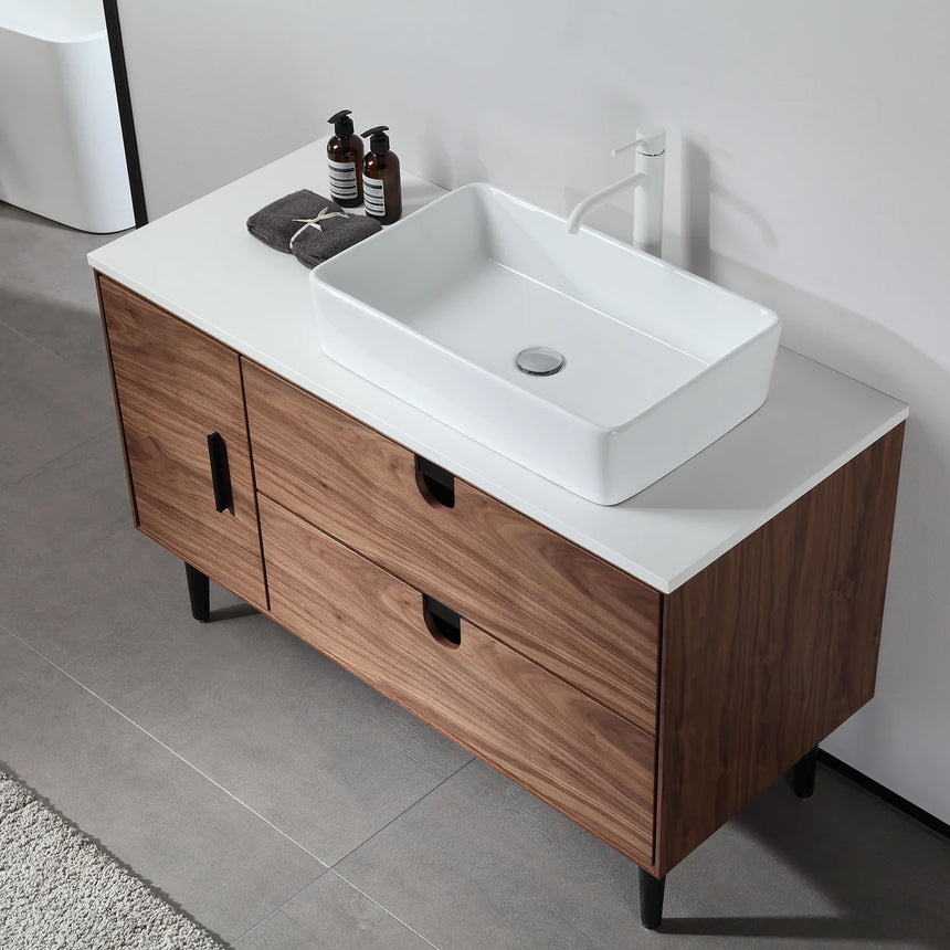 Bathroom vanity with two sinks, mirrors, and decorative elements.