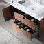 Bathroom vanity with open wooden drawers and a white sink.