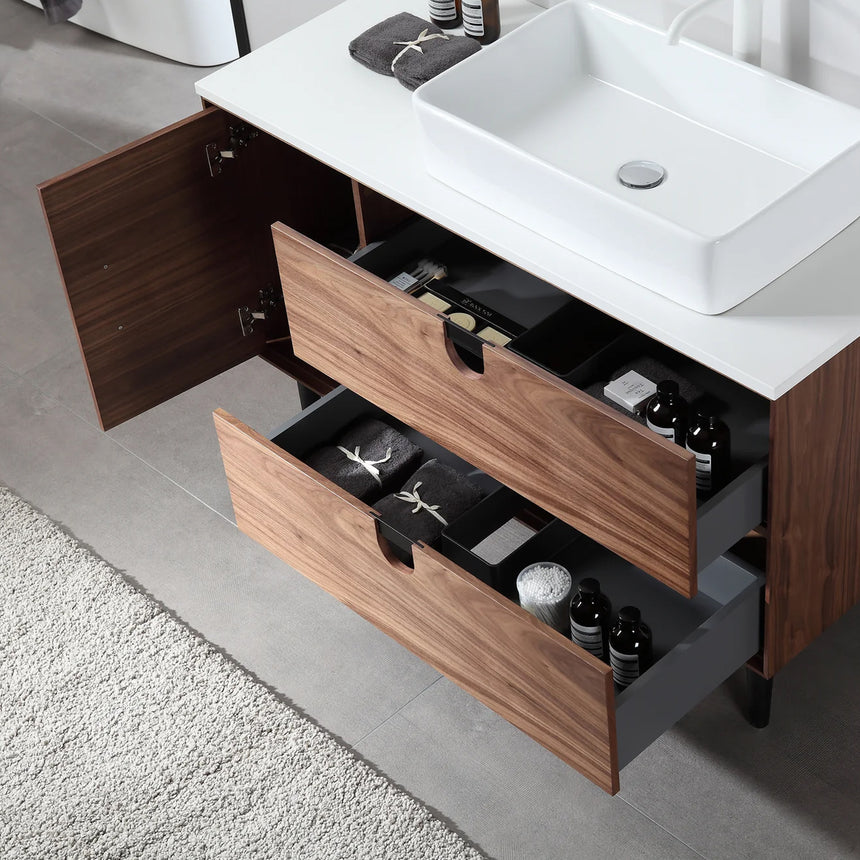 Bathroom vanity with two sinks, mirrors, and decorative elements.