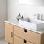 Bathroom vanity with white countertop, sink, and wooden cabinets.