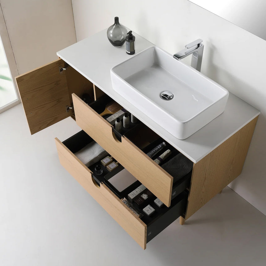Bathroom vanity with two sinks, mirrors, and decorative elements.