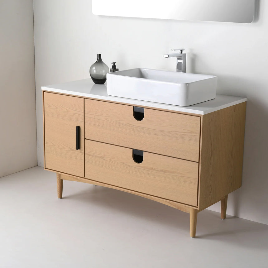Bathroom vanity with two sinks, mirrors, and decorative elements.
