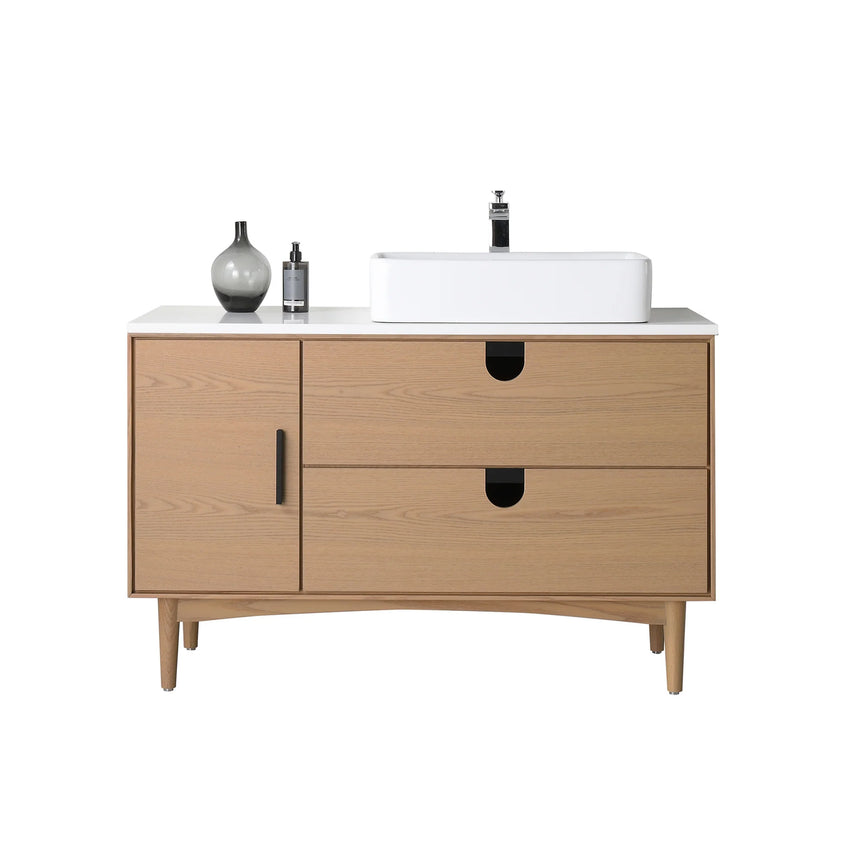 Bathroom vanity with two sinks, mirrors, and decorative elements.