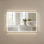 Bathroom with a large illuminated mirror reflecting a marble countertop and sink.