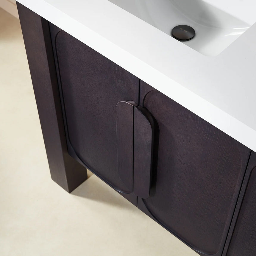 Bathroom with wooden vanity, white countertop, and decorative elements.