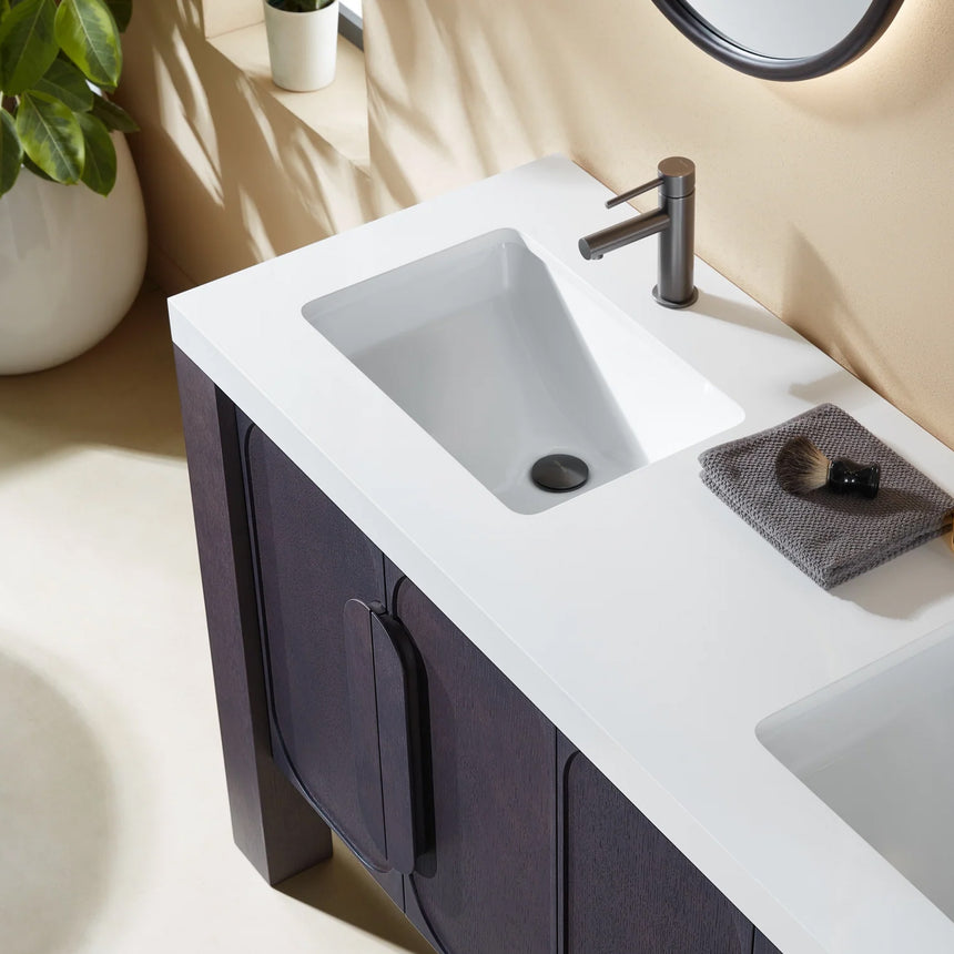 Bathroom with wooden vanity, white countertop, and decorative elements.