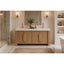 Bathroom with wooden vanity, white countertop, and decorative elements.