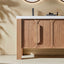 Wooden bathroom vanity with a white countertop and decorative items.