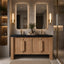 Bathroom vanity with wooden cabinets, black countertop, and illuminated mirrors.