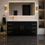 Modern bathroom with black vanity, white countertop, and gold fixtures.