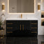 Modern bathroom vanity with black cabinets, gold fixtures, and a large mirror.