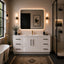 Modern bathroom with white vanity, large mirror, and decorative elements.