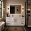Modern bathroom with a white vanity, illuminated mirror, and decorative elements.