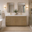 Bathroom with wooden vanity, mirrors, and decorative elements.