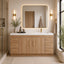 Bathroom with wooden vanity, mirror, and decorative elements