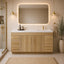 Modern bathroom with wooden vanity, mirror, and decorative elements.