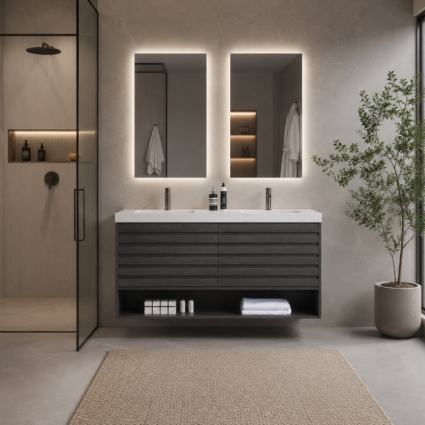 A modern floating bathroom vanity with a light oak wood finish, a white countertop, and an integrated sink, shown in a styled bathroom setting with a bathtub, shower glass, and decorative plants.