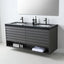 A modern floating double-sink bathroom vanity with a dark charcoal gray wood-grain cabinet, a black countertop, and two matte black faucets, shown against a light gray wall with a mirror above.