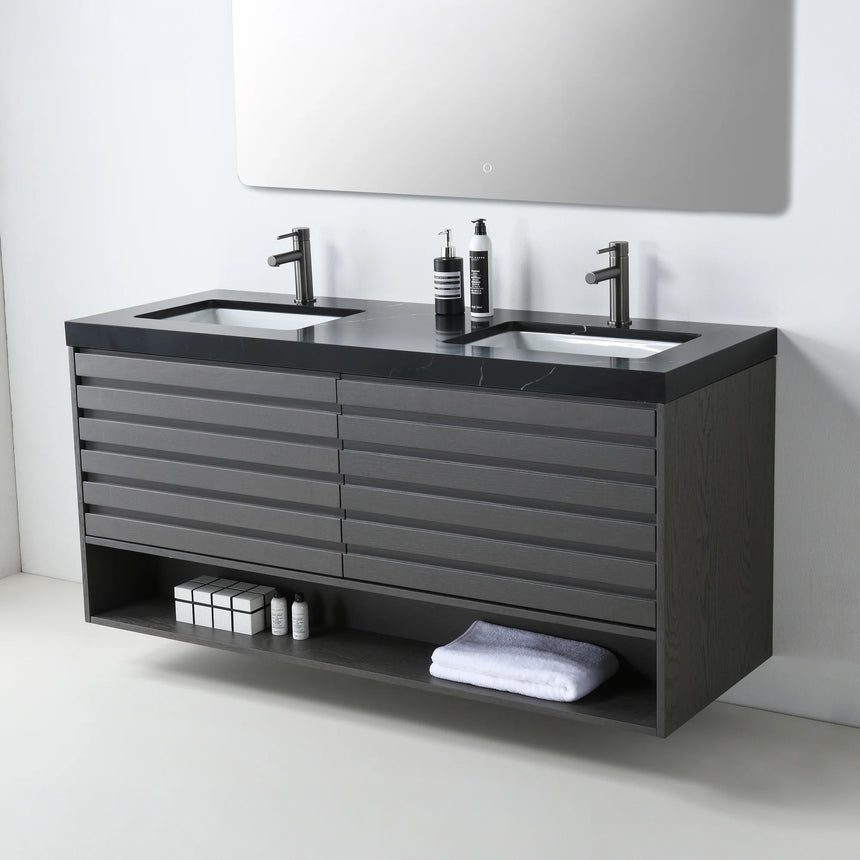 A modern floating bathroom vanity with a light oak wood finish, a white countertop, and an integrated sink, shown in a styled bathroom setting with a bathtub, shower glass, and decorative plants.